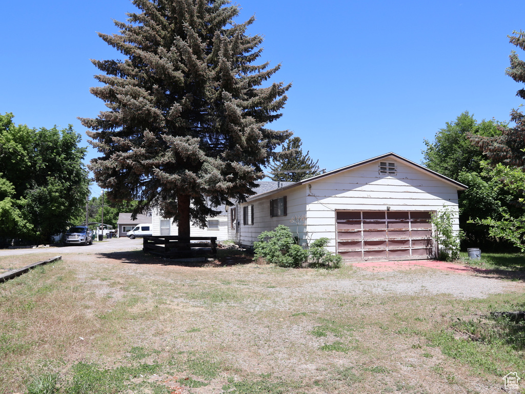 View of yard with an attached garage