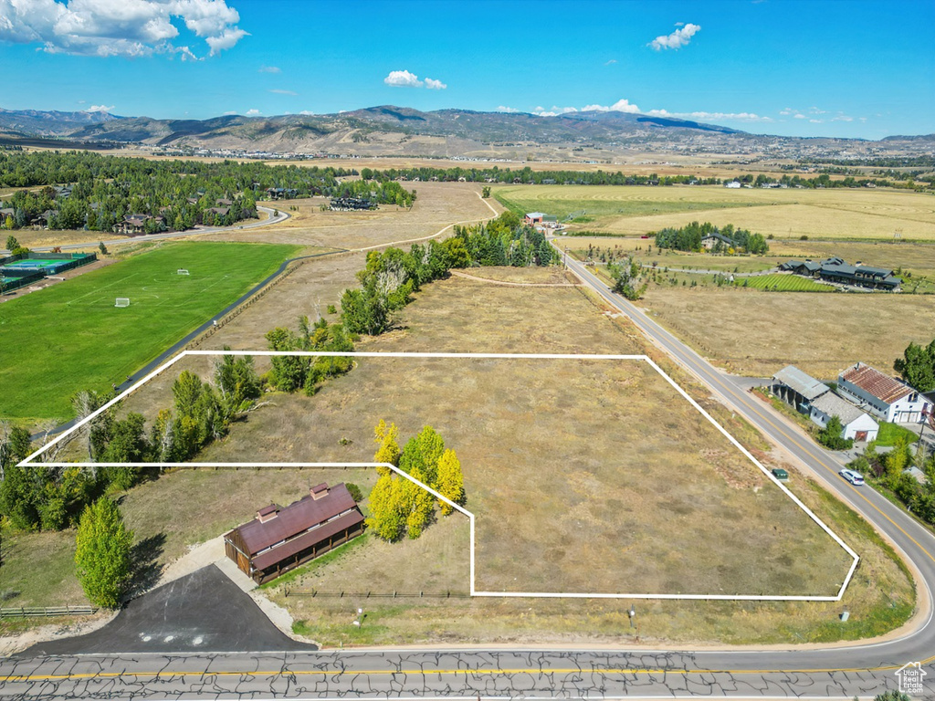 View of rural area featuring property boundaries highlighted and a mountainous background
