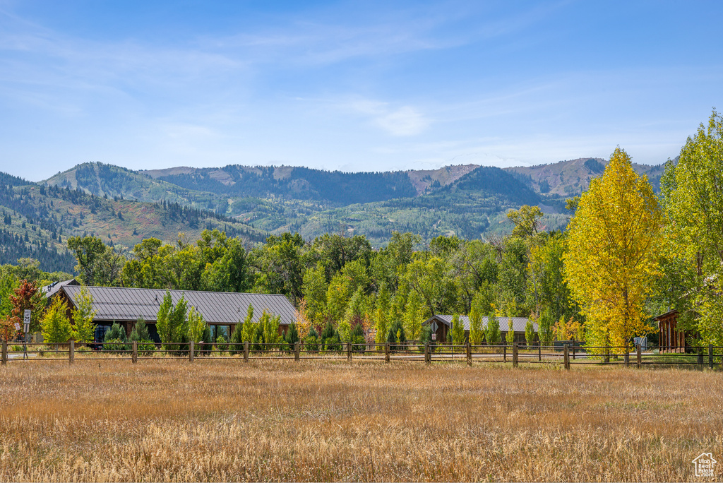 View of mountain background featuring rural landscape