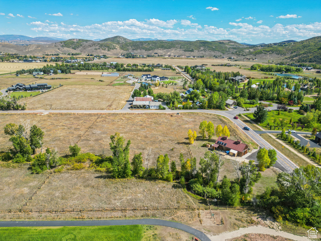 Aerial view of sparsely populated area featuring a mountainous background