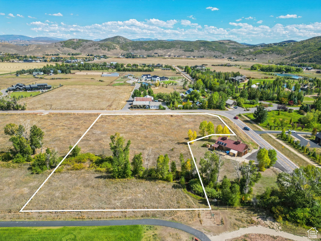 View of rural area featuring property parcel outlined and a mountain backdrop