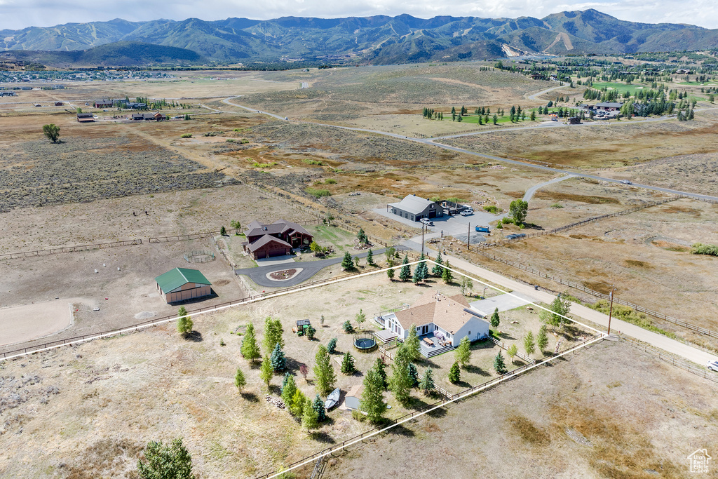 Aerial view of sparsely populated area featuring a mountain backdrop