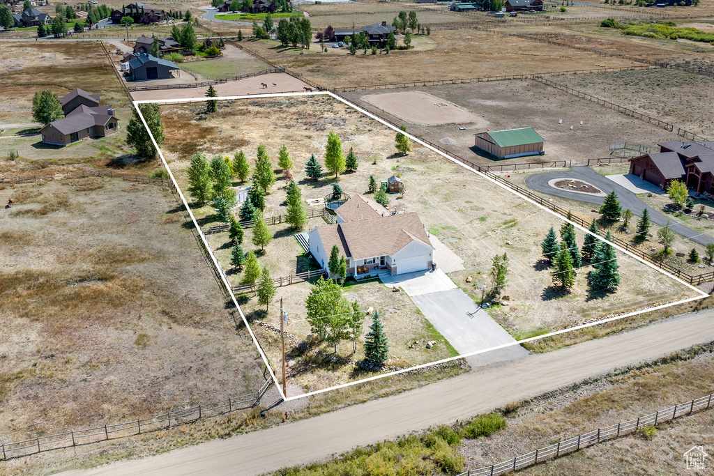 Aerial view of sparsely populated area with property parcel outlined