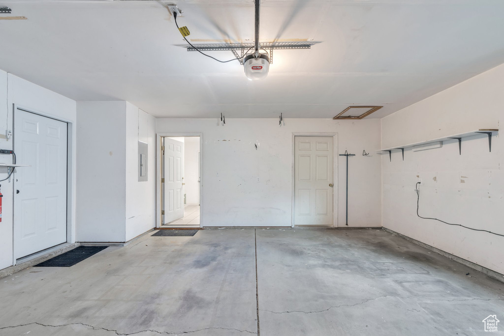 Garage with a garage door opener and electric panel