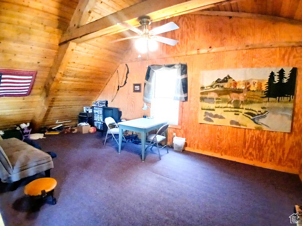 Rec room featuring wood ceiling, carpet, ceiling fan, and wood walls