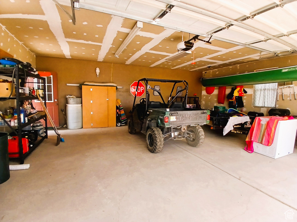 Garage featuring a garage door opener