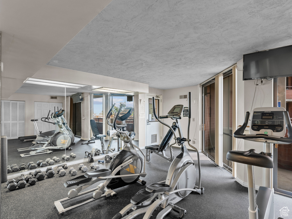 Exercise room featuring a textured ceiling