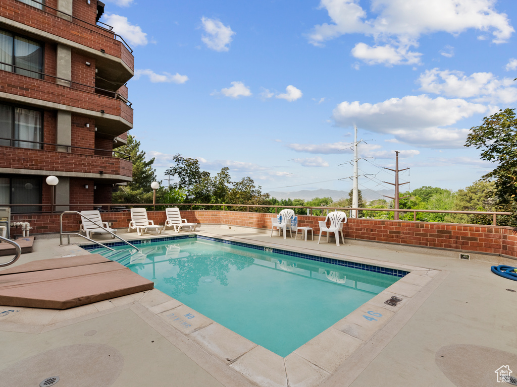 Community pool with a patio area