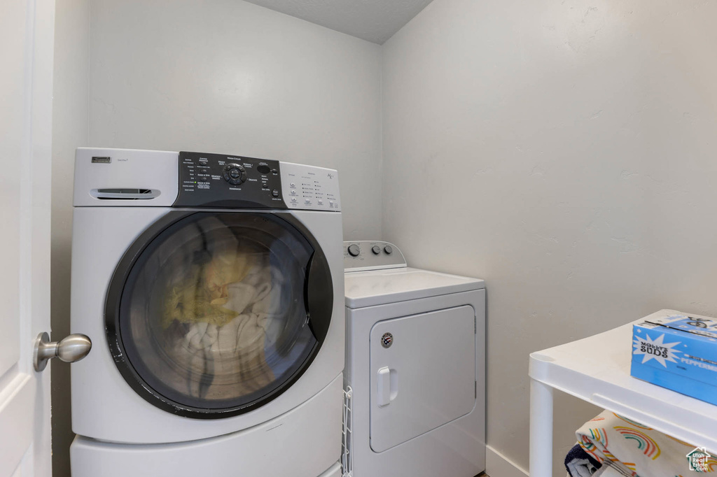 Laundry room with washing machine and dryer