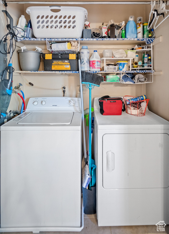 Laundry room featuring separate washer and dryer