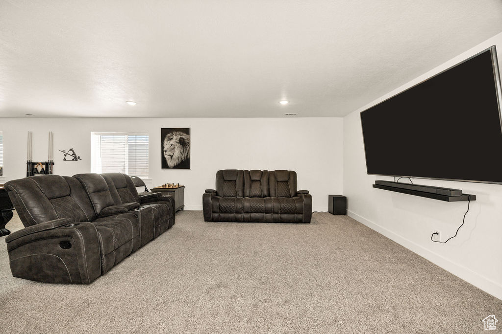 Living area featuring carpet, recessed lighting, and baseboards