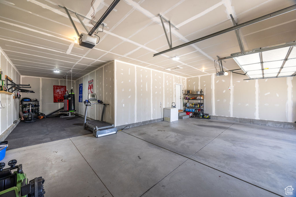 Garage featuring a garage door opener