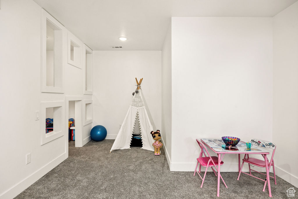 Game room with carpet floors and baseboards