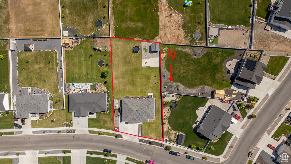 Aerial perspective of suburban area with property parcel outlined