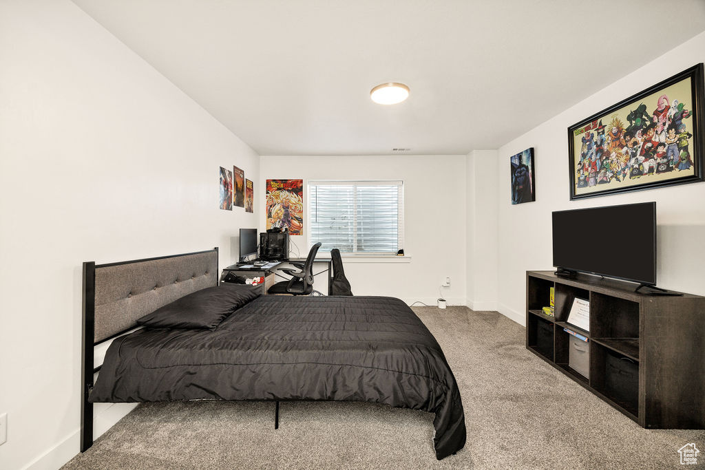 Carpeted bedroom with baseboards