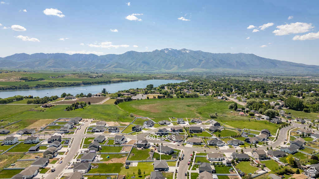 Aerial perspective of suburban area featuring a water and mountain view