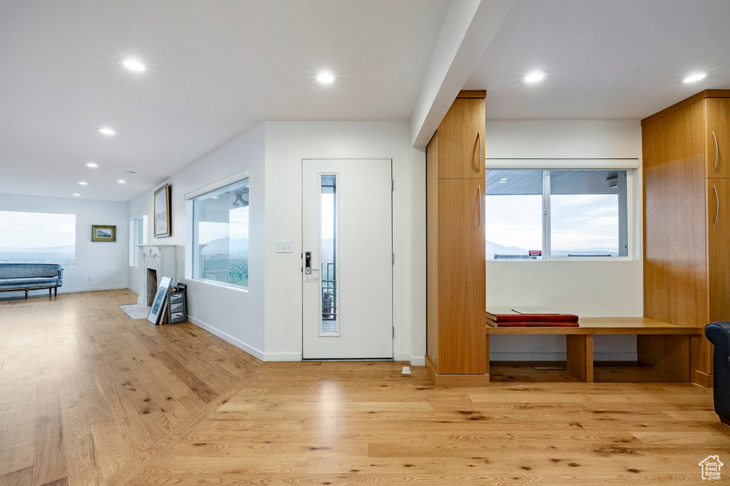 Entryway with light wood-type flooring, recessed lighting, and baseboards