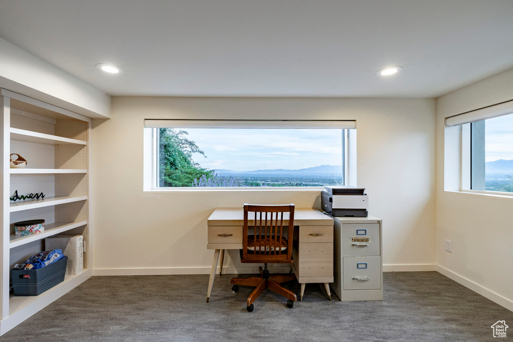 Home office featuring healthy amount of natural light, recessed lighting, baseboards, and a mountain view