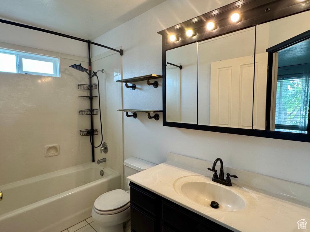 Full bathroom with toilet, shower / washtub combination, vanity, and tile patterned flooring