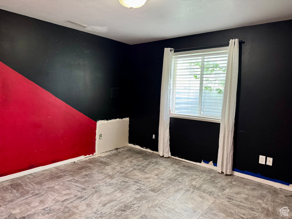 Unfurnished room with baseboards