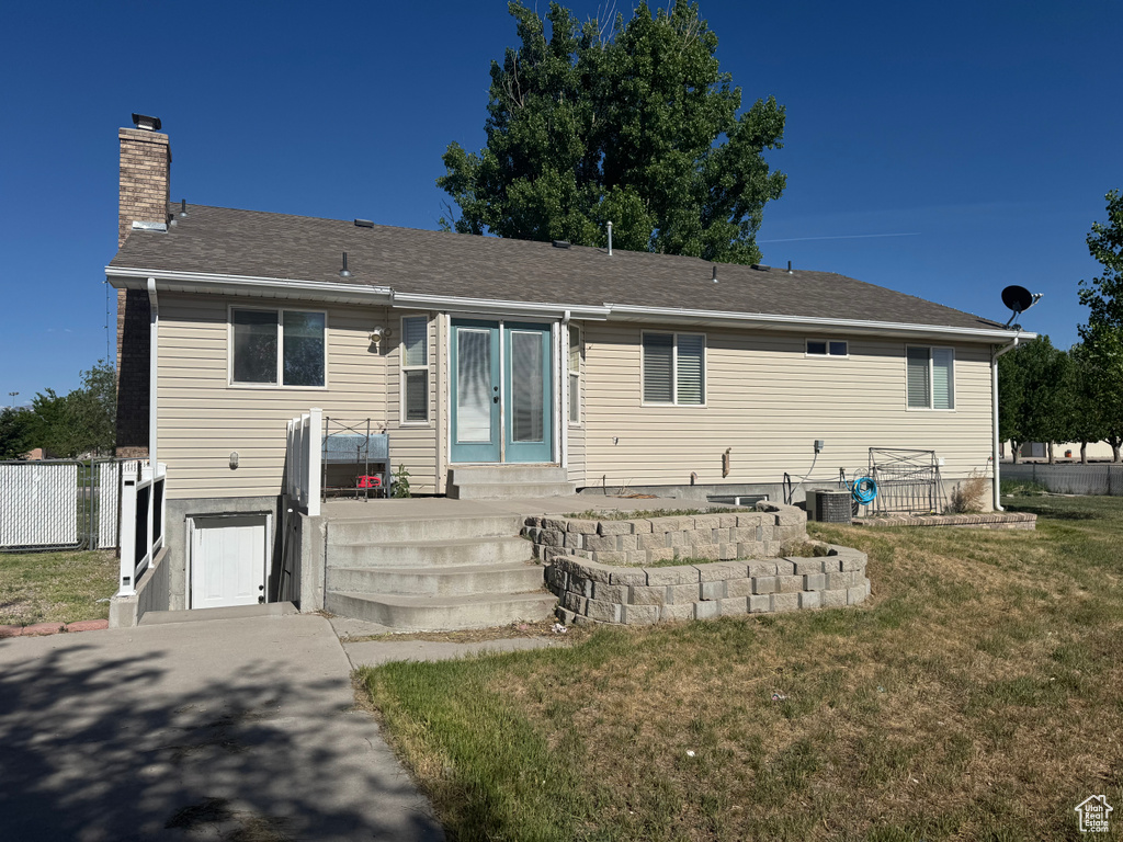 Rear view of property with a chimney