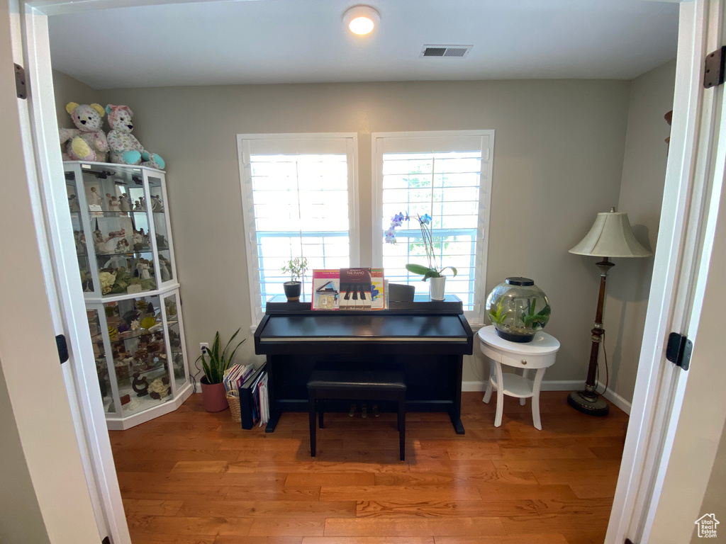 Office space featuring light wood-style floors, plenty of natural light, and recessed lighting