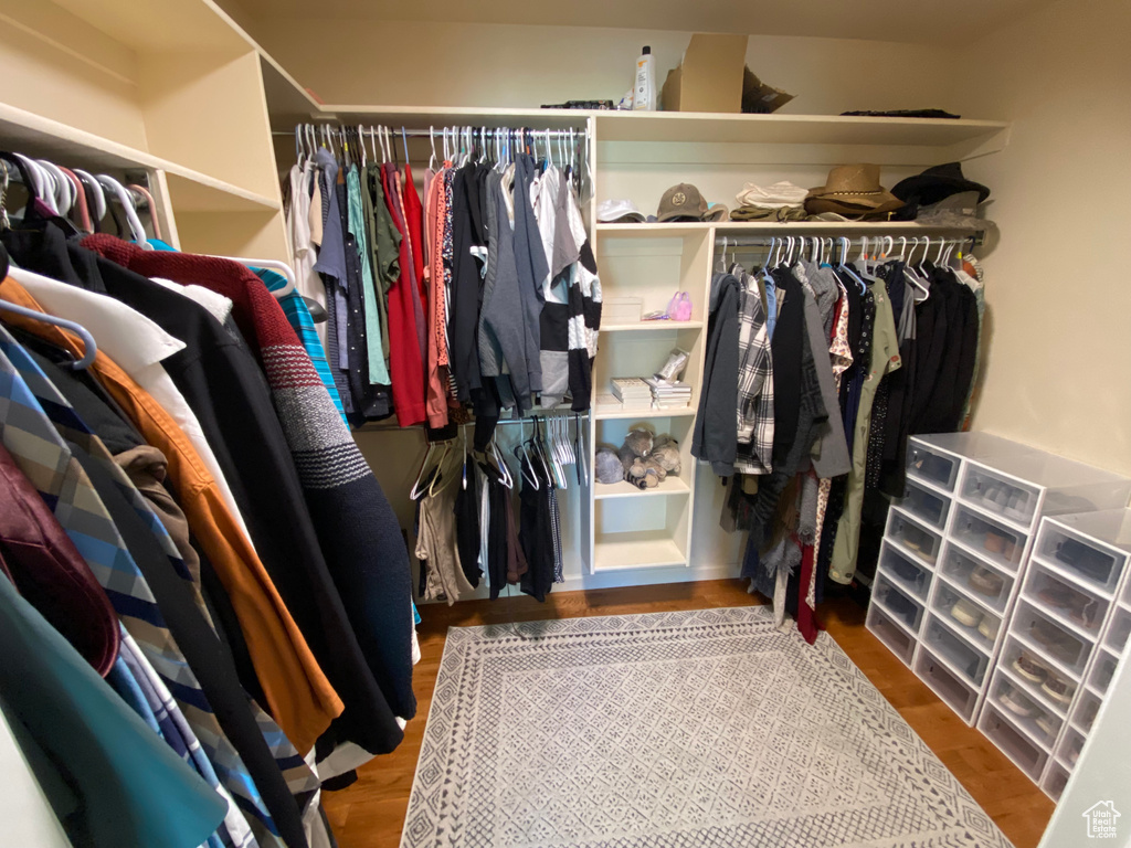 Spacious closet with wood finished floors