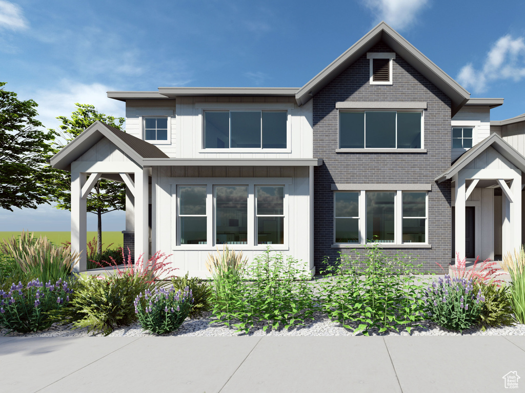 View of front of property with brick siding