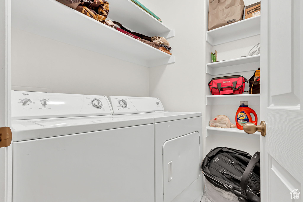 Laundry area with washer and clothes dryer