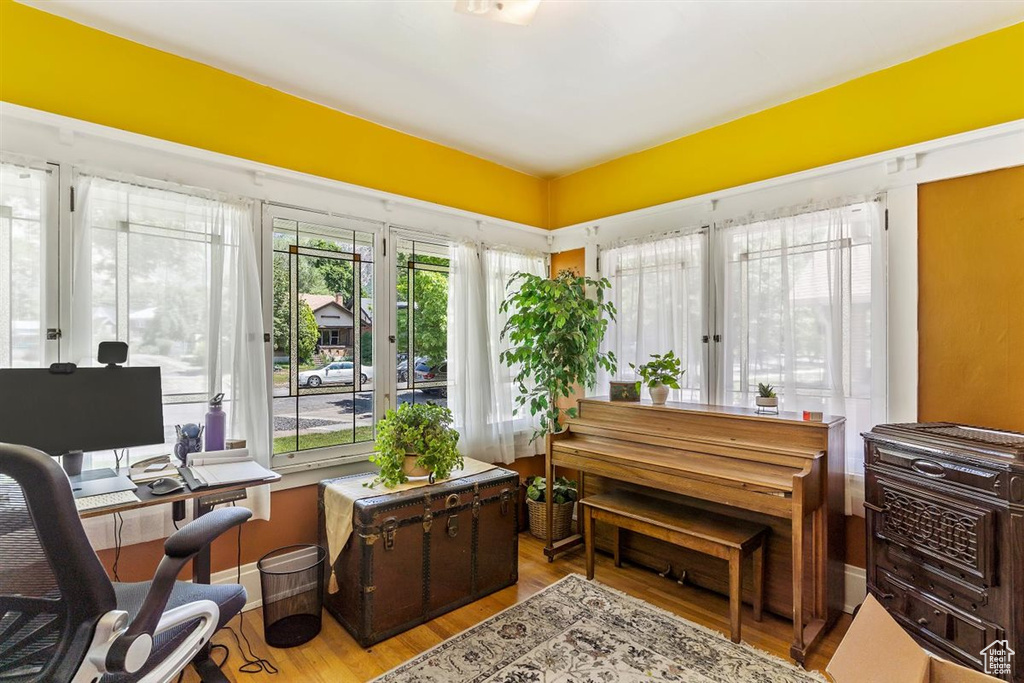 Home office with wood finished floors