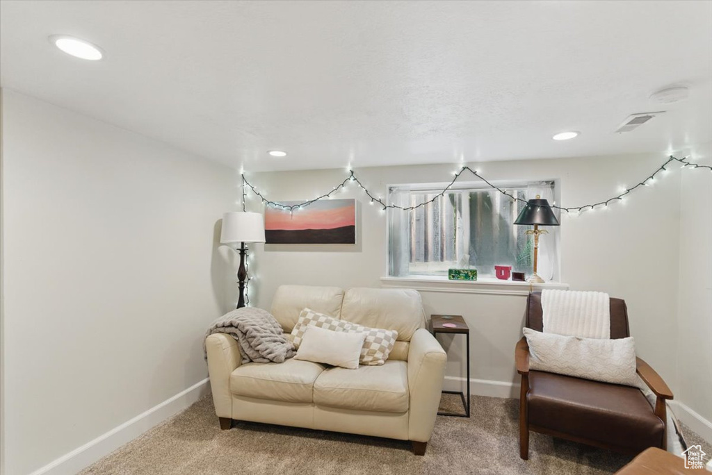 Sitting room with baseboards, carpet flooring, and recessed lighting
