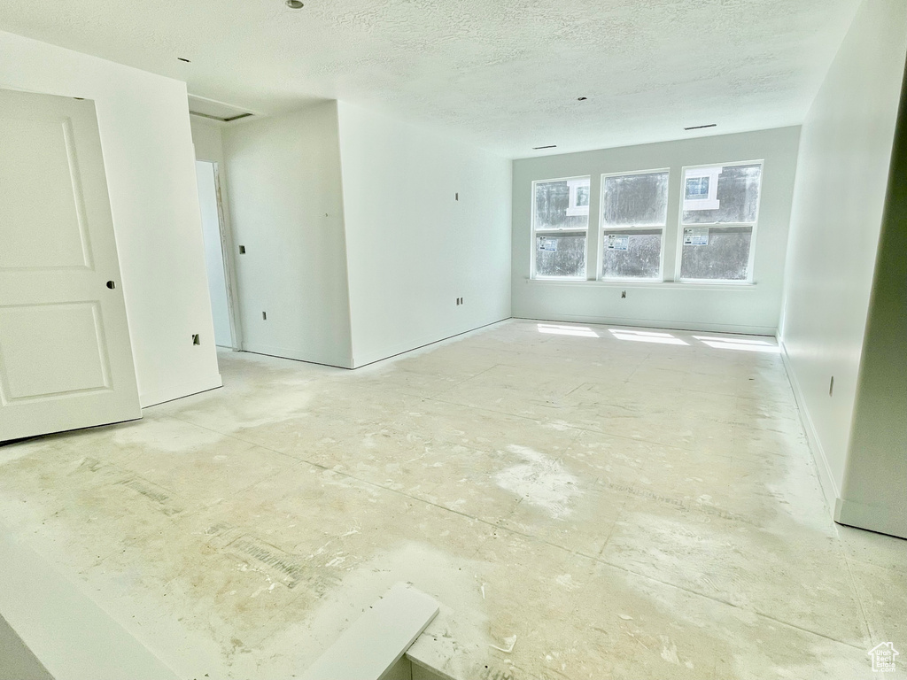 Spare room featuring a textured ceiling