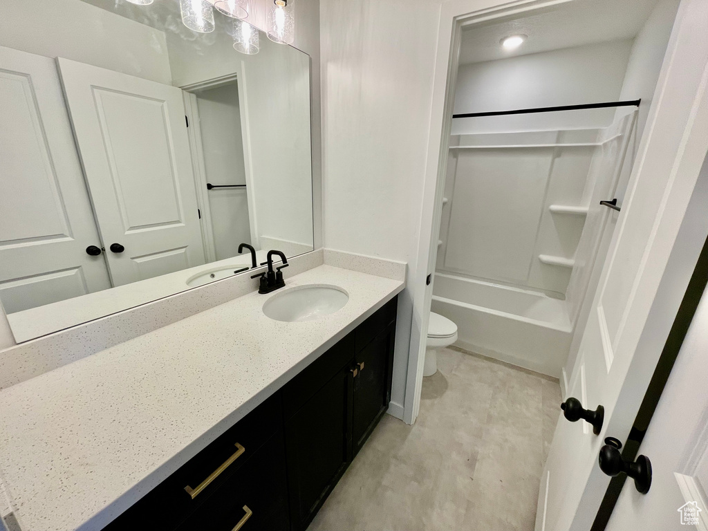 Full bath featuring vanity and shower / tub combination