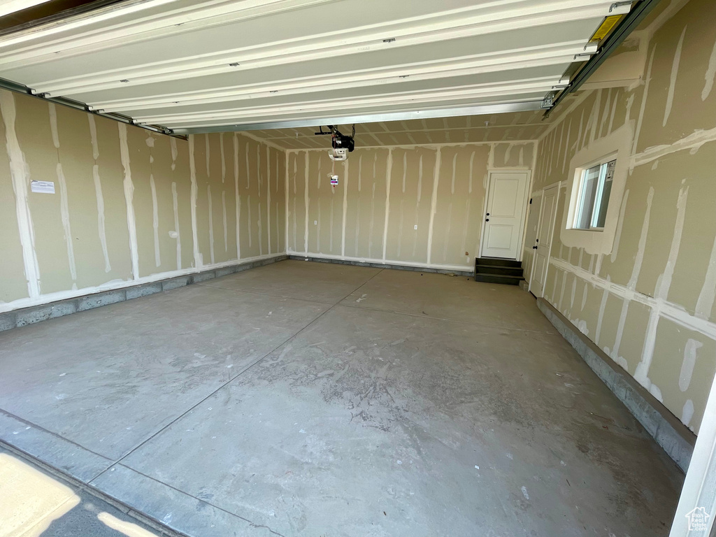Garage featuring a garage door opener