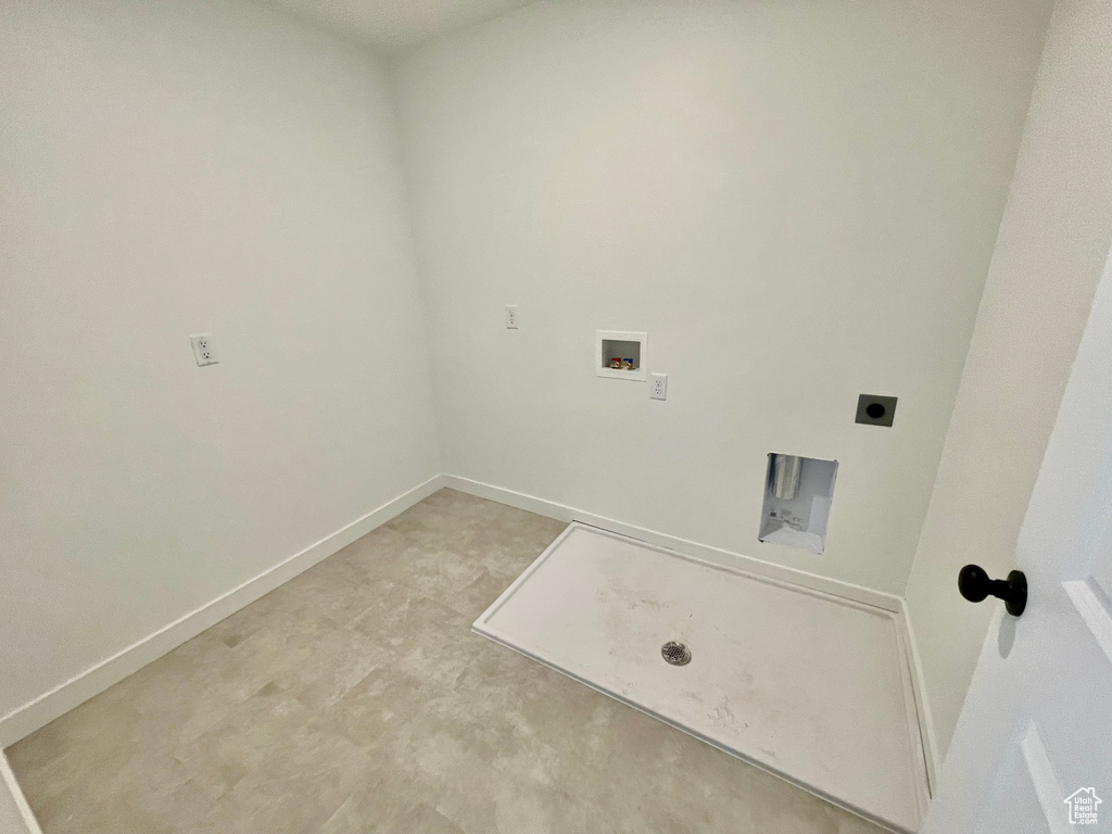 Laundry room with hookup for a washing machine and hookup for an electric dryer