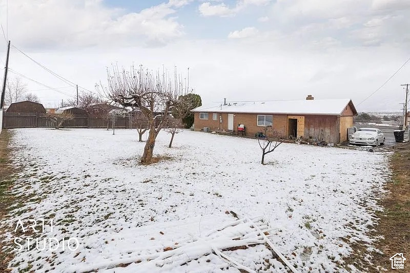 View of yard layered in snow