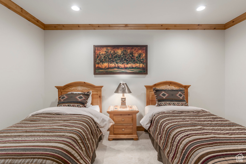 Bedroom featuring light carpet, recessed lighting, and crown molding