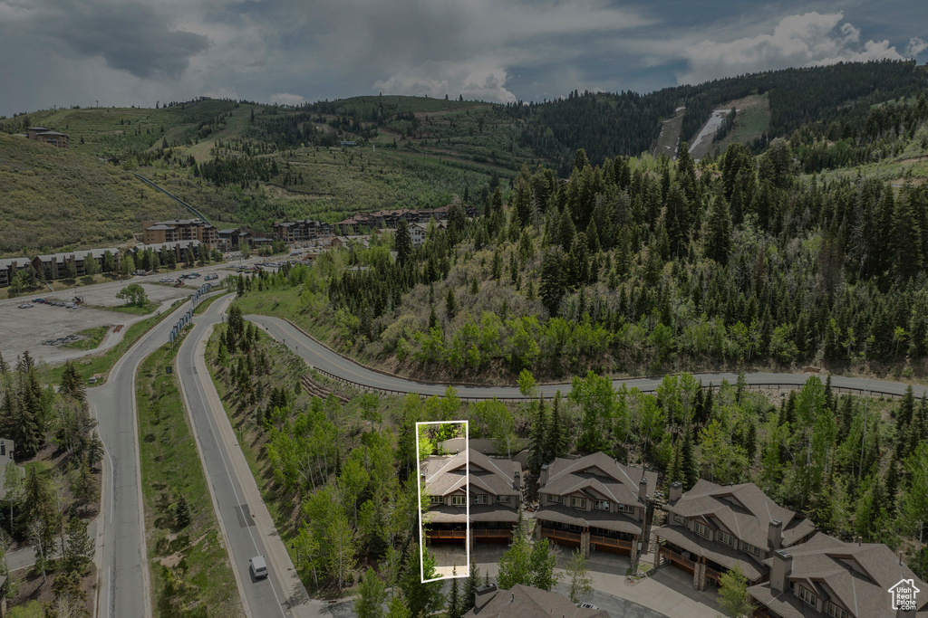 View of property location featuring property parcel outlined and a heavily wooded area