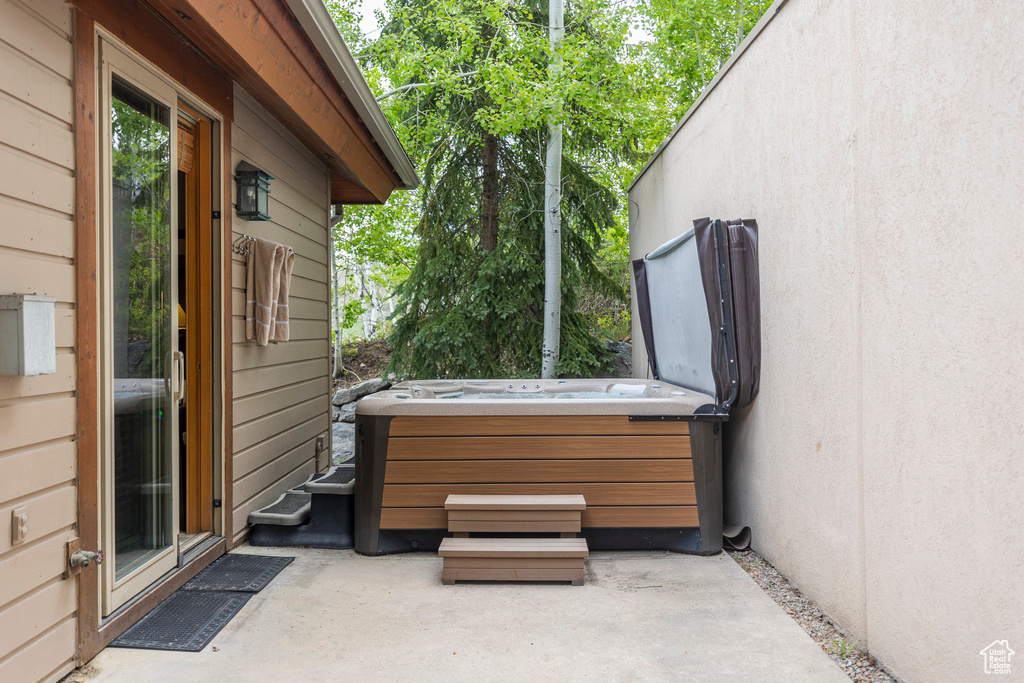 View of patio / terrace with a hot tub