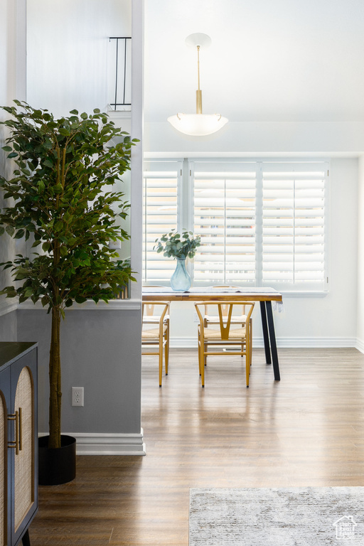 Dining room featuring wood finished floors and baseboards