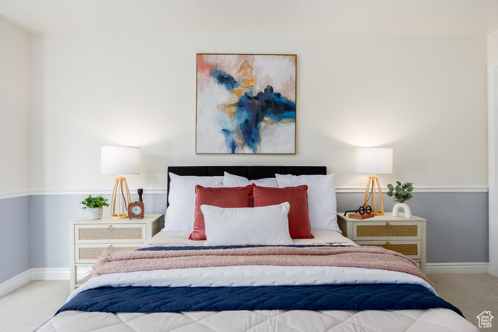 Carpeted bedroom with baseboards