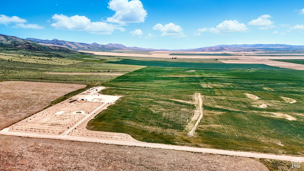 View of mountain backdrop with rural landscape