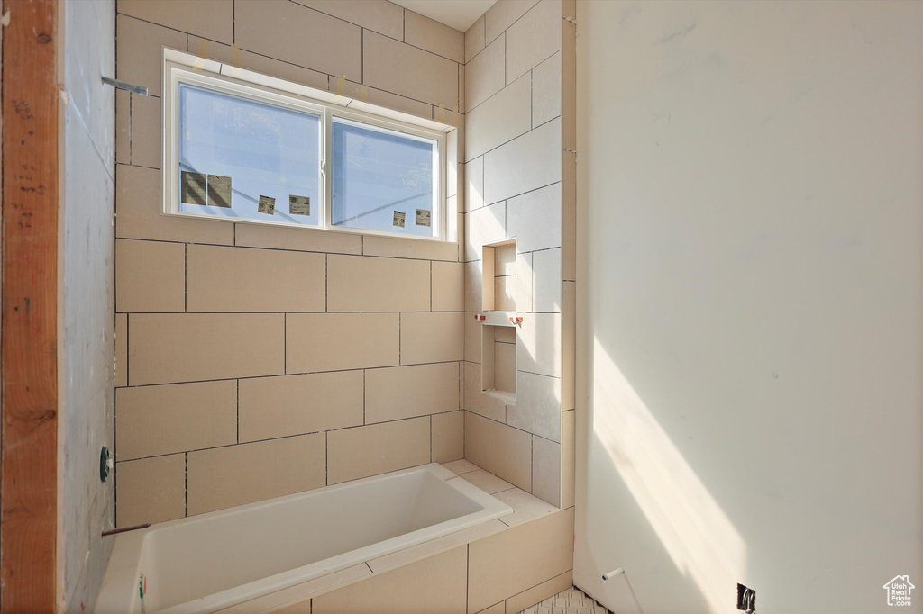 Full bath featuring a tub