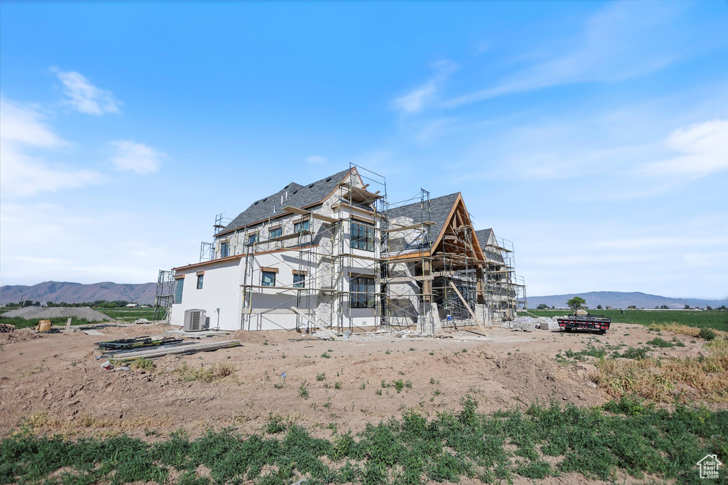 Rear view of house with a mountain view