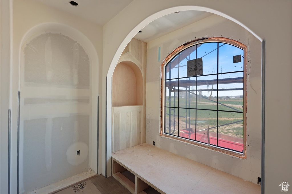 Interior space with healthy amount of natural light and wood finished floors