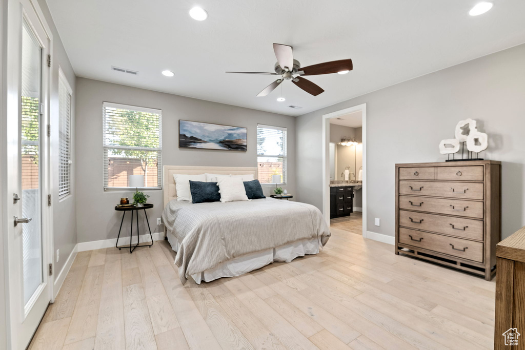 Bedroom with light wood-style flooring, baseboards, recessed lighting, a ceiling fan, and ensuite bathroom