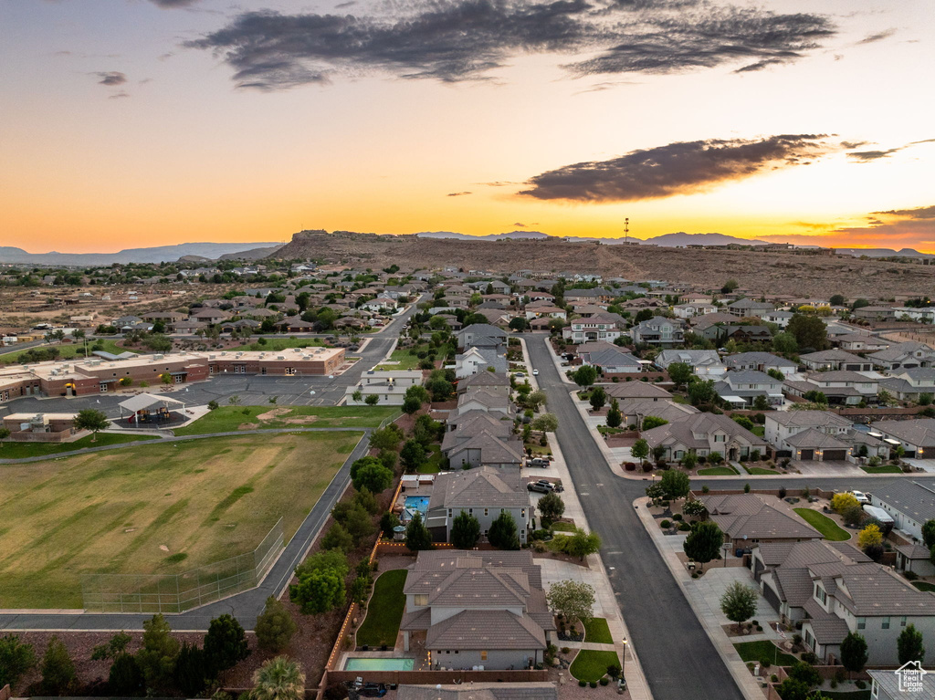Aerial overview of property's location featuring nearby suburban area and mountains