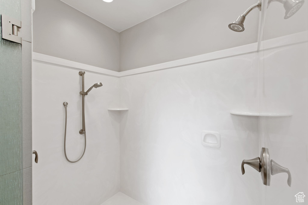 Full bathroom with a shower stall