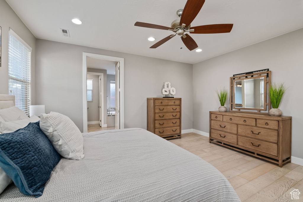 Bedroom with light wood-type flooring, recessed lighting, baseboards, and a ceiling fan