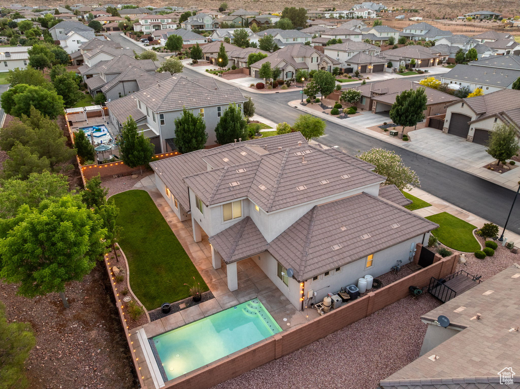 Aerial perspective of suburban area with a pool area